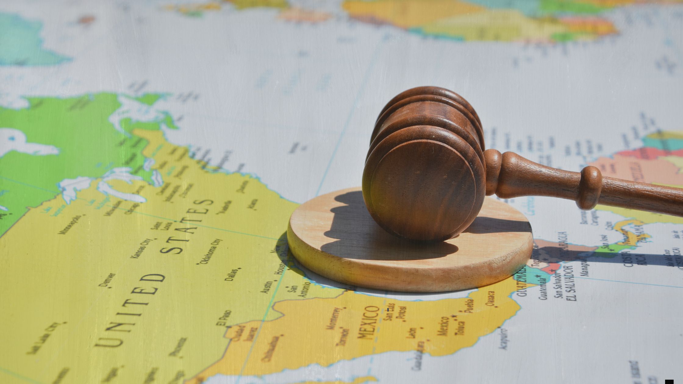 international law gavel on a map